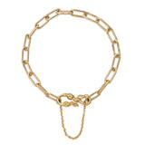 Solid gold paperclip chain bracelet with textured hook clasp and safety chain.