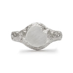 Round signet ring in sterling silver with matte face and textured band.