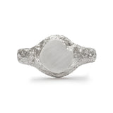 Round signet ring in sterling silver with matte face and textured band.