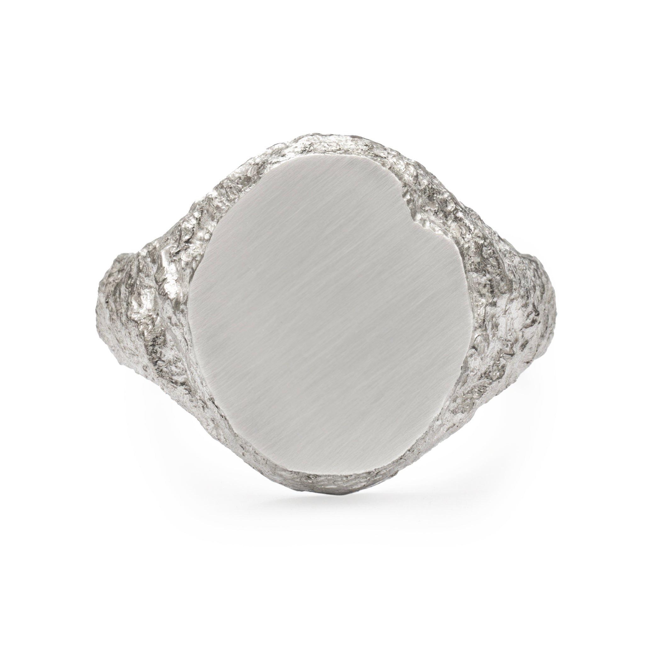 Oval signet ring in sterling silver with textured shoulders and chipped facade.