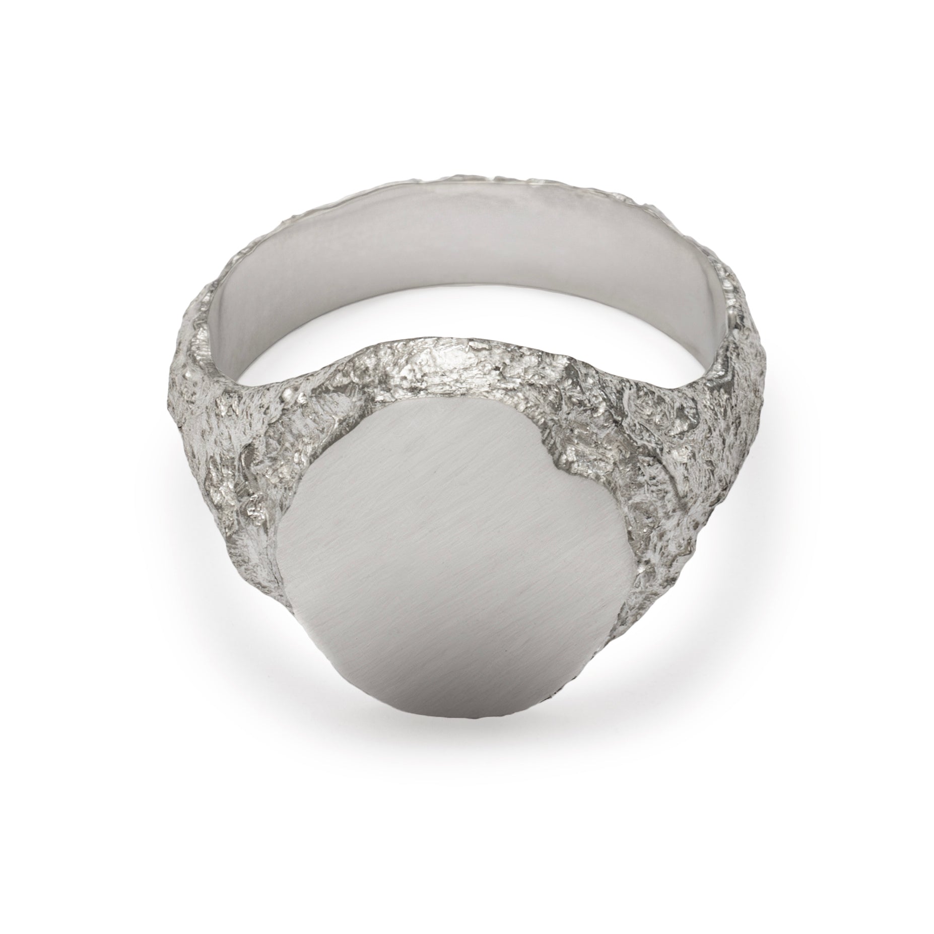 Top view of signet ring in sterling silver with textured shoulders and chipped facade.