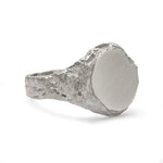 Geological view of side signet ring in sterling silver with matte face and textured band.