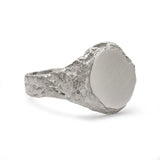 Geological view of side signet ring in sterling silver with matte face and textured band.