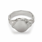 Medium round signet ring in sterling silver with matte face and textured band.