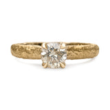 Champagne diamond engagement ring with textured gold band and four-claw setting.