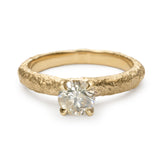 Champagne diamond engagement ring with slim textured gold band and four-claw setting.