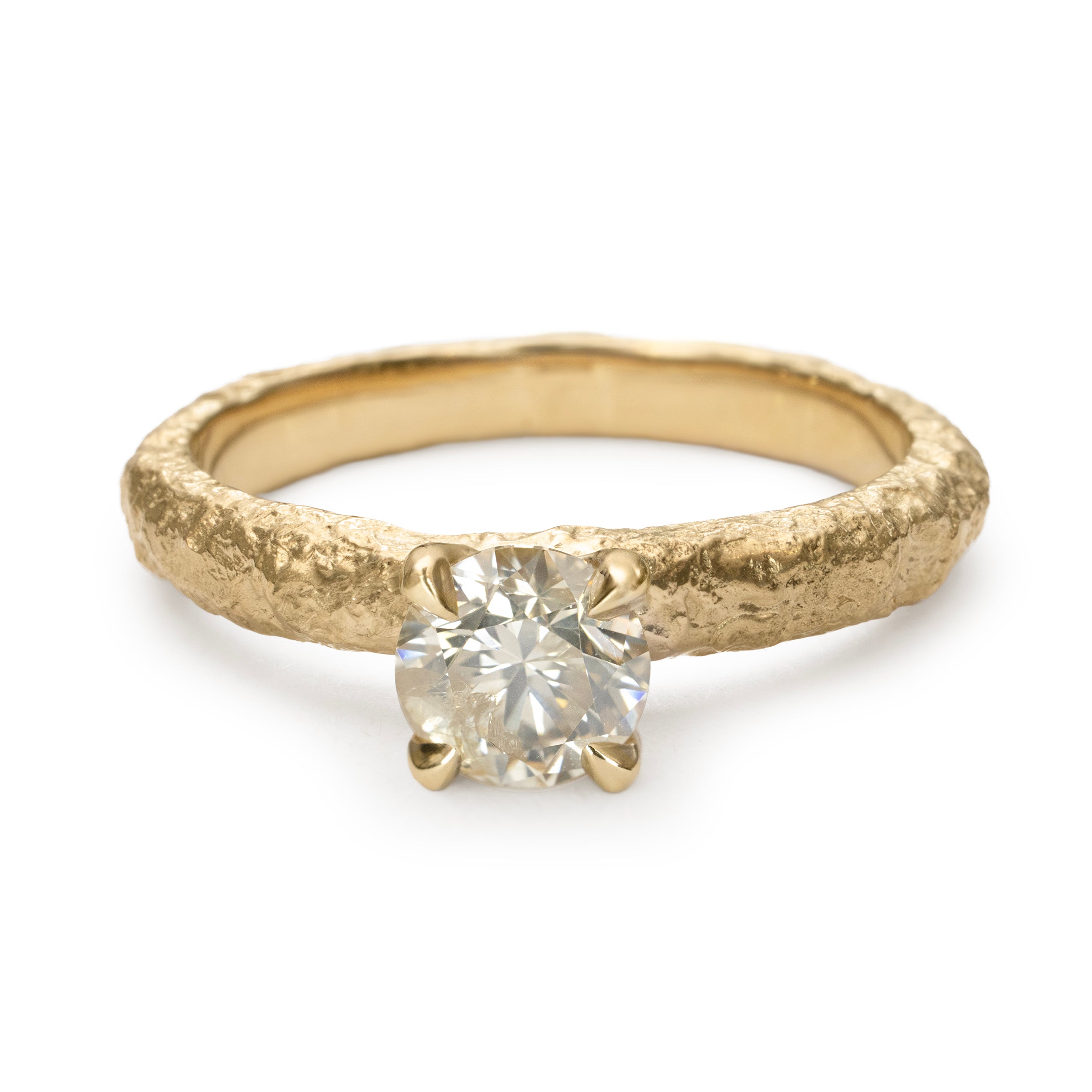 Champagne diamond engagement ring with slim textured gold band and four-claw setting.