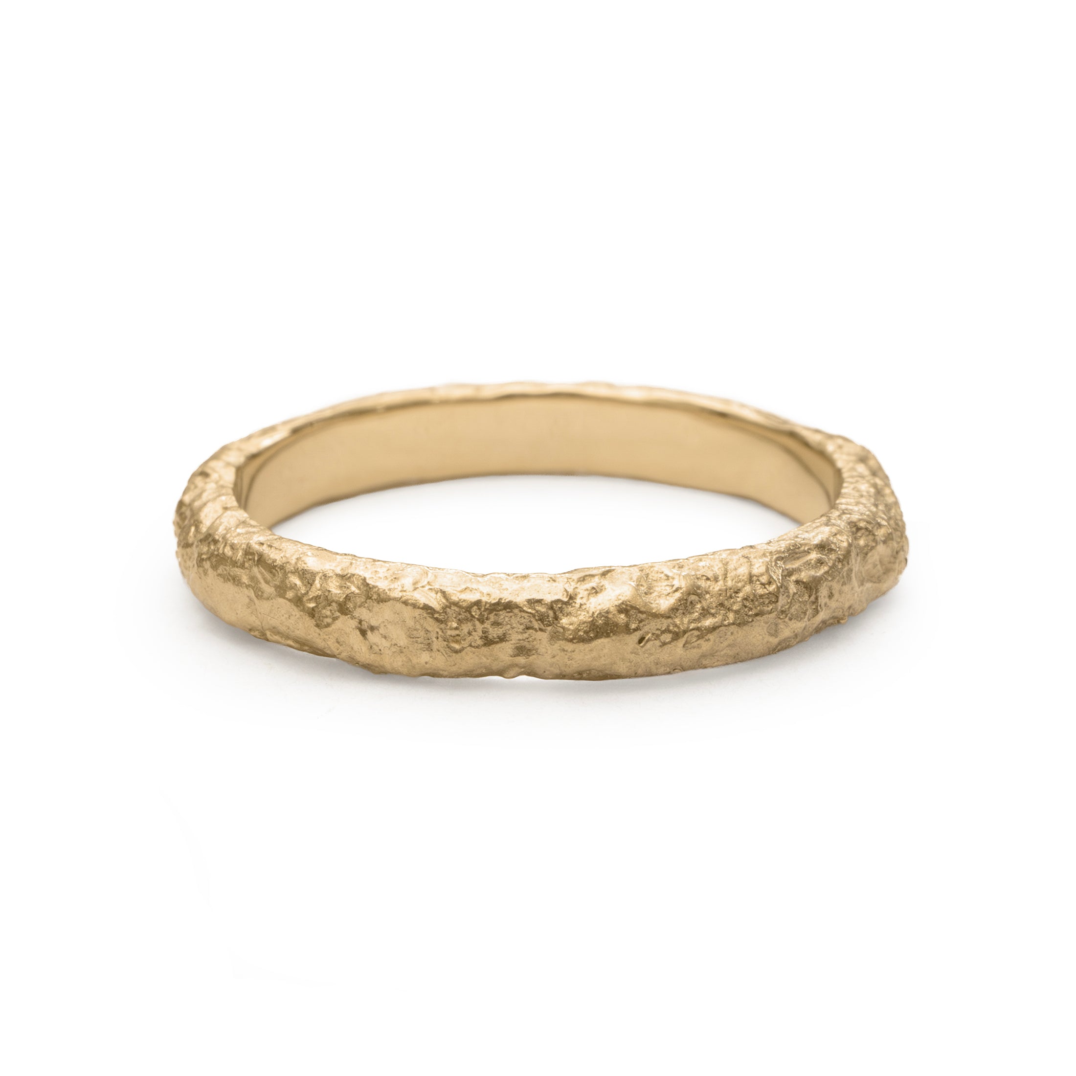 Front view of textured yellow gold wedding band with eroded surface